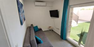 TV a/nebo společenská místnost v ubytování Vip Deluxe Apartment Arian