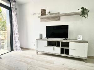 A television and/or entertainment centre at ISLAND SUITES