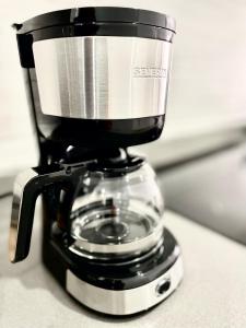 Coffee and tea making facilities at ISLAND SUITES