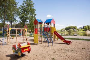 a park with a playground with a slide and a toy car at Lapių Ola in Utena