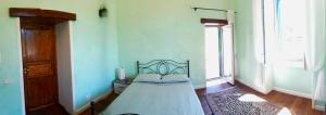 A bed or beds in a room at Villa Mazza al Vesuvio