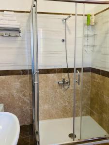 a bathroom with a shower and a sink at Armonia B&B in Aquino +15 photos
