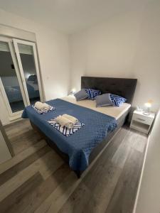 Ein Bett oder Betten in einem Zimmer der Unterkunft Villa Iva Vodice