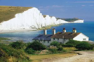 a house in front of a white cliffs at 2 Bedroom Apartment Ground Floor Eastbourne Town Centre in Eastbourne
