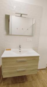 a bathroom with a sink and a mirror at Studio La ciotat Les Anges du Vieux Port in La Ciotat