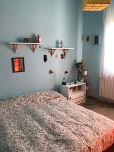 Кровать или кровати в номере Il tuo angolo di paradiso