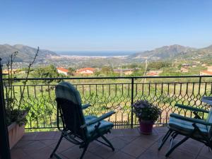 a chair sitting on a balcony with a view at Il tuo angolo di paradiso in Monreale