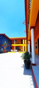 a large building with a clock on the side of it at Hotel Ecológico Temazcal in Creel