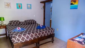 Letto o letti in una camera di Roatan Backpackers' Hostel