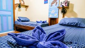 Letto o letti in una camera di Roatan Backpackers' Hostel