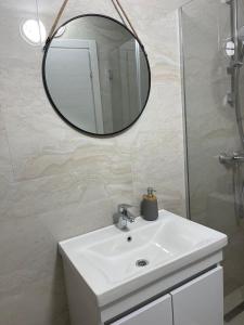 Ett badrum på Apartments Adok
