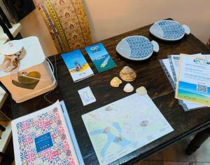 a table with cards and other items on it at Senhor Gigi in Faro +77 photos