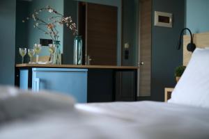 Posteľ alebo postele v izbe v ubytovaní CONTE CRISTO Suites