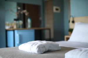 Posteľ alebo postele v izbe v ubytovaní CONTE CRISTO Suites