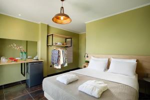 Posteľ alebo postele v izbe v ubytovaní CONTE CRISTO Suites