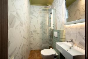Kylpyhuone majoituspaikassa CONTE CRISTO Suites