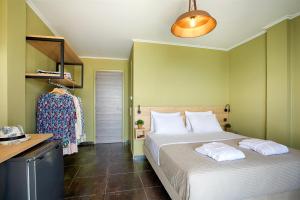 Posteľ alebo postele v izbe v ubytovaní CONTE CRISTO Suites