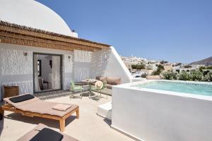 a villa with a swimming pool and a patio at Alleys All-Suite Hotel & Spa in Pirgos