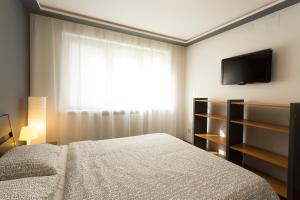 Llit o llits en una habitació de Sibiu Central Apartment