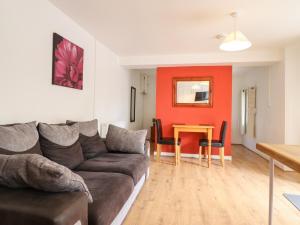 a living room with a couch and a table at Tryfan in Bangor
