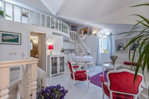 a living room with a staircase and a dining room at Apartment Rosana - ZF Hvar in Hvar