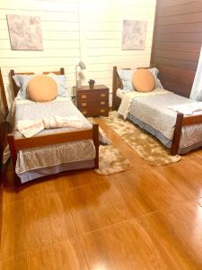 En eller flere senge i et værelse på Casa centro Capivari 700m distância