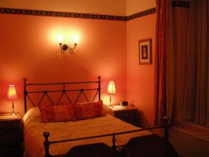 Cama o camas de una habitación en Buckingham Hotel