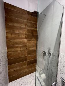 a shower with a glass door in a bathroom at Costa Adriatica Apartments in Durrës
