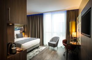Ein Bett oder Betten in einem Zimmer der Unterkunft Leonardo Hotel Eschborn Frankfurt