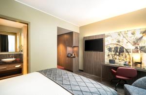 Ein Bett oder Betten in einem Zimmer der Unterkunft Leonardo Hotel Eschborn Frankfurt