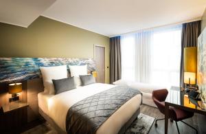 Ein Bett oder Betten in einem Zimmer der Unterkunft Leonardo Hotel Eschborn Frankfurt