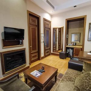 A television and/or entertainment center at Sultan Inn Boutique Hotel