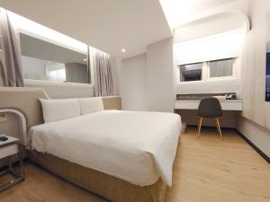 Postelja oz. postelje v sobi nastanitve Hub Hotel Ximen Inn