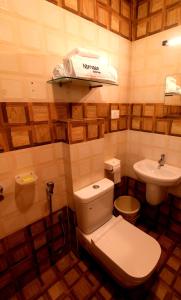 Koupelna v ubytování Nirrvaan homestay + 11 fotografií