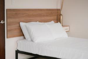Hotel Fratelli tesisinde bir odada yatak veya yataklar