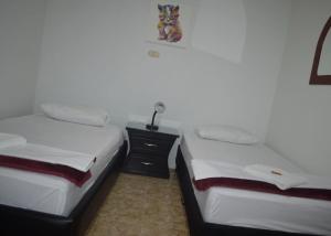 Cama o camas de una habitación en AROMA CAFÉ II