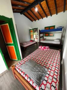Postel nebo postele na pokoji v ubytování Finca Hotel karey -Quindio