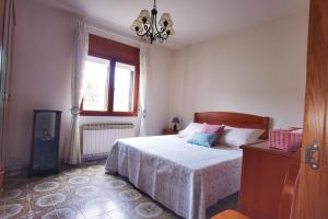 Postel nebo postele na pokoji v ubytování Foz Acogedora casa familiar