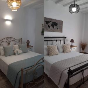 2 camas en una habitación con paredes blancas en Alisachni, en Kini