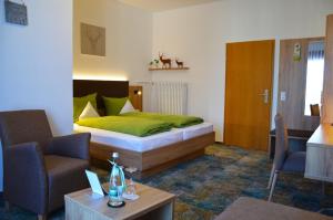 Säng eller sängar i ett rum på Gasthof zur Traube