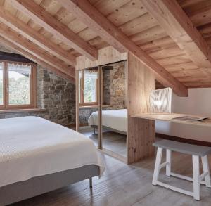 Posteľ alebo postele v izbe v ubytovaní Apartamentos Ea Astei