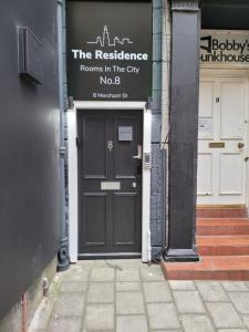 a door of a building with a sign for the residence rooms in the city at The Residence - NO 8 in Edinburgh