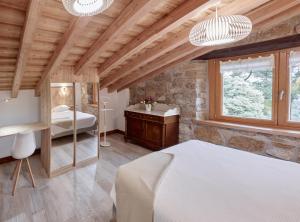 Posteľ alebo postele v izbe v ubytovaní Apartamentos Ea Astei