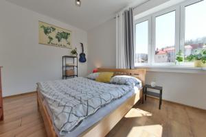 En eller flere senge i et værelse på Veľký 2i byt 75m2 pri Opere v priamom centre Banskej Bystrice, AC klíma, balkón