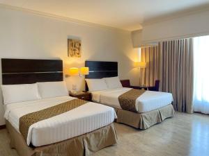 Postel nebo postele na pokoji v ubytování Days Hotel by Wyndham Iloilo
