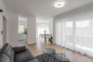 a living room with a couch and a table at coaSTal apartment 1 in Split