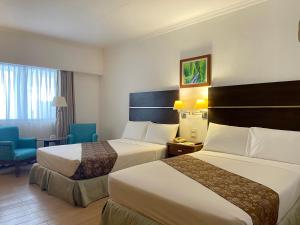 Postel nebo postele na pokoji v ubytování Days Hotel by Wyndham Iloilo