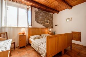 A bed or beds in a room at Stella Sud Podere Carbone