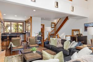 a living room with a couch and a table at Aspen Ridge 9 in Telluride
