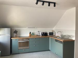 Kuchyň nebo kuchyňský kout v ubytování Karádi apartman + 18 fotografií